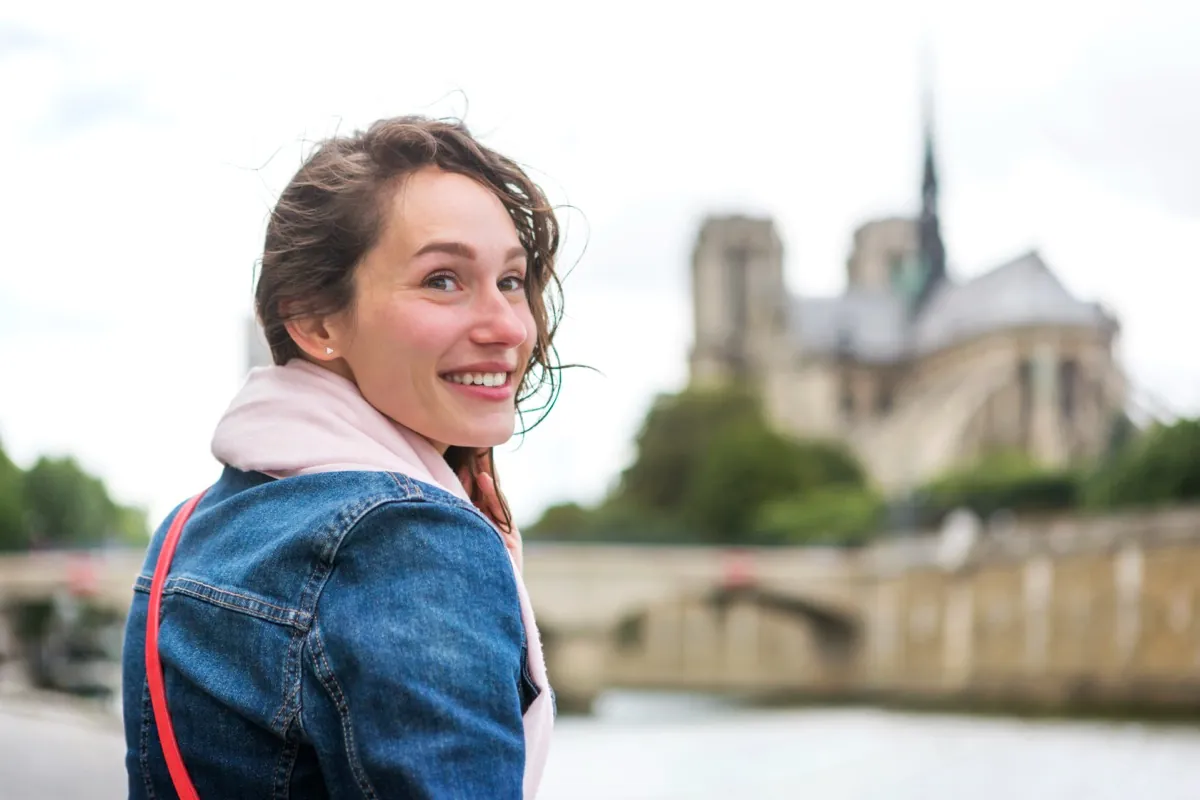 Young woman by the Seine in Paris